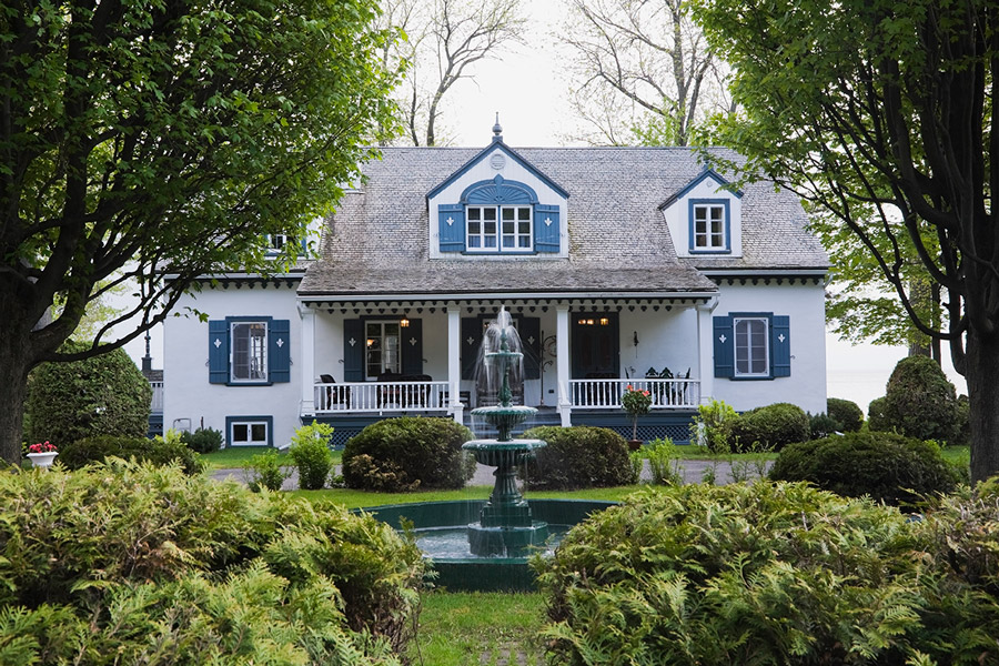 small-white-with-blue-trim-1920s-cottage-style-house-fac-2024-10-21-09-02-42-utc